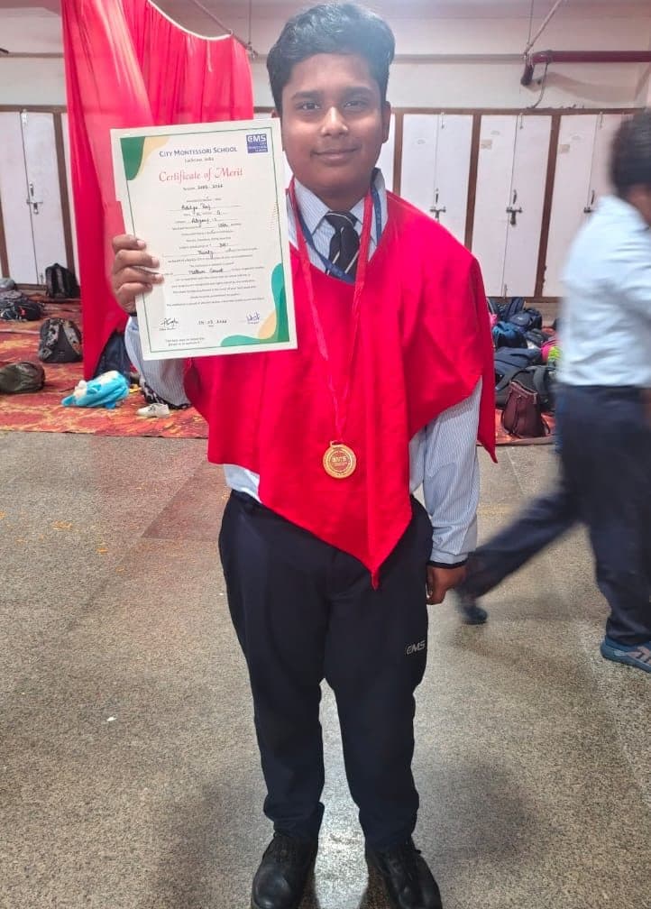 Student displaying a certificate of merit won through online study