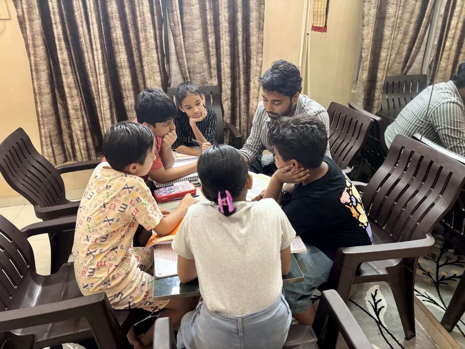 Junior students solving problems together with faculty support